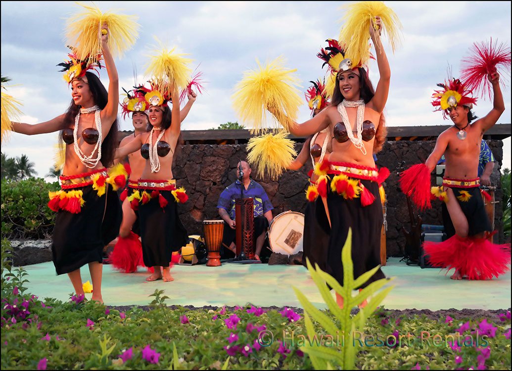 Luau at night with Hawaiian Hula dancers and musicians on stage