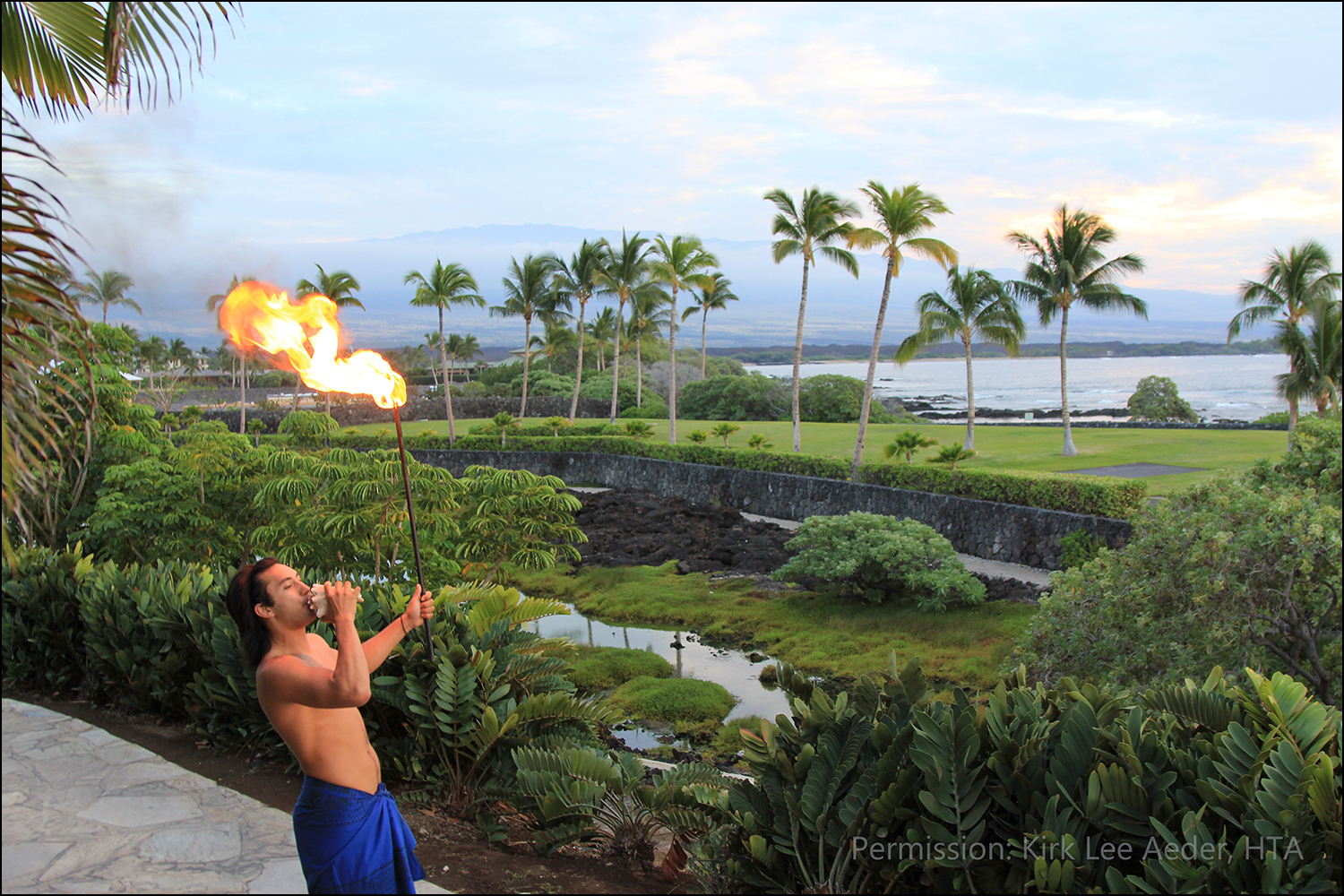 Waikoloa Beach Resort with Hawaiian man blowing conch shell